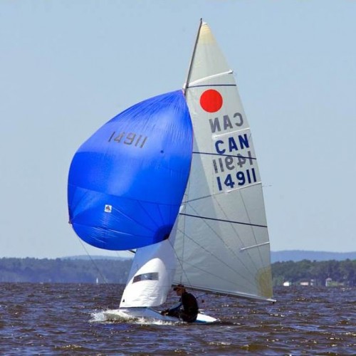 Fireball sailboat sailing downwind with spinnaker