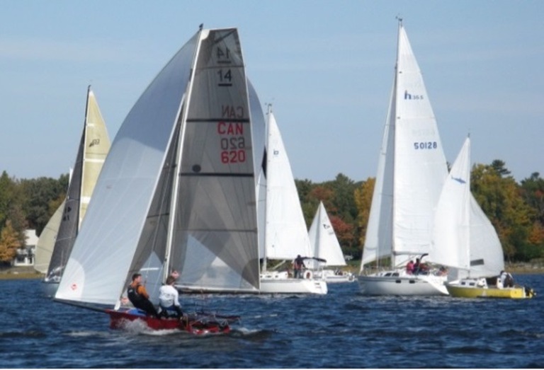 Many types of sail boats racing together at Turkey Trot