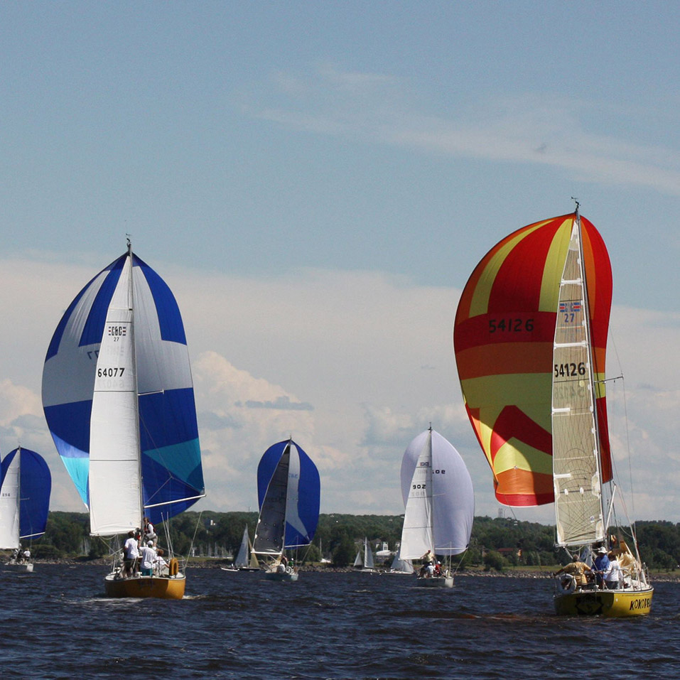 Keelboats racing downwind with spinnakers