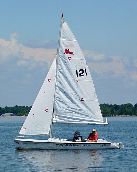 A Martin 16 with two people sailing it.