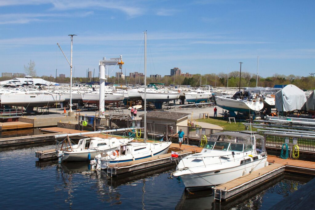 Boats at the service docks with the yard and crane in the background