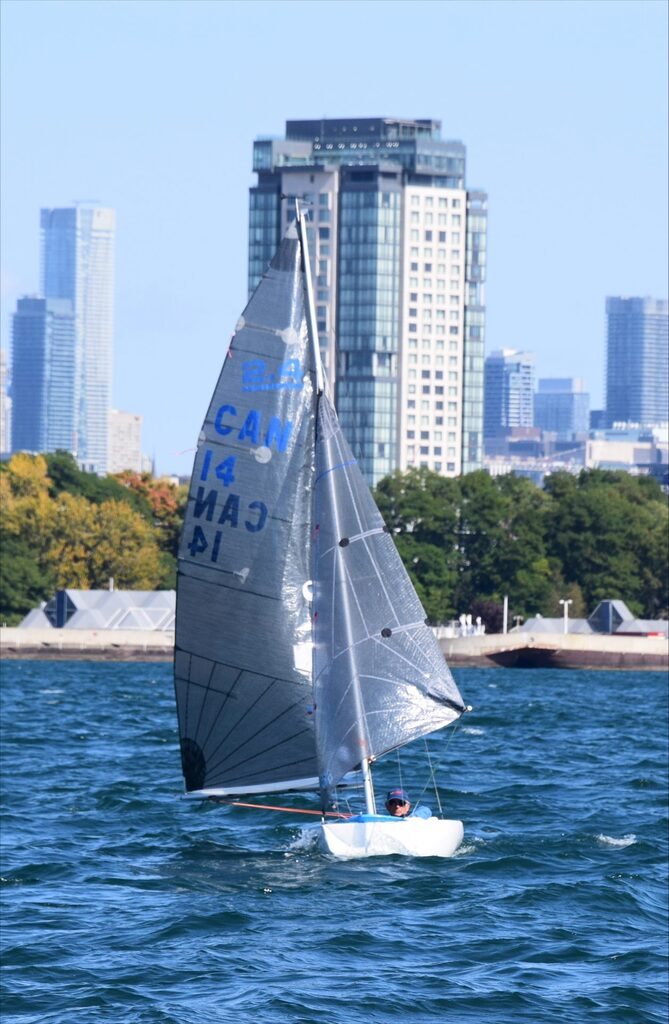 Pete Norwood in his 2.4mR at the 2023 Canadian 2.4mR Championship with Toronto in the background