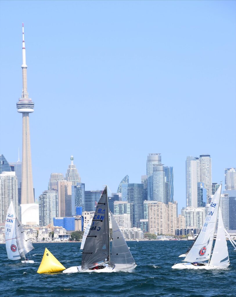 Pete Norwood rounding a mark in his 2.4mR at the 2023 Canadian Championships with Toronto in the background