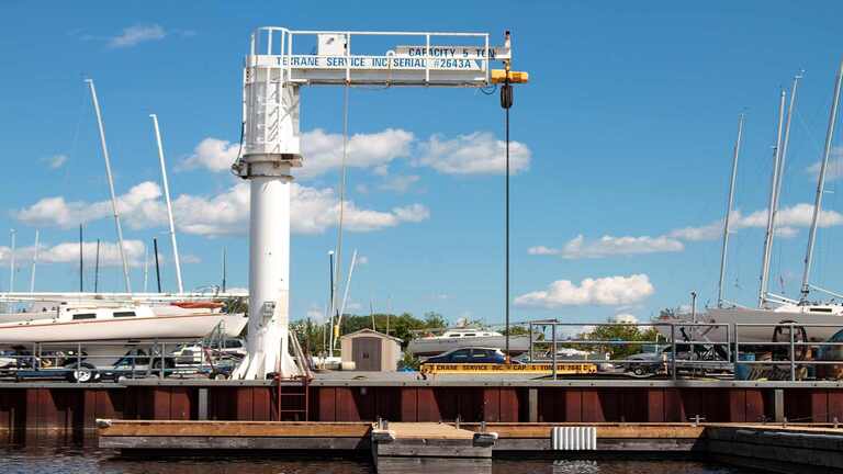 Crane with blue sky and puffy clouds