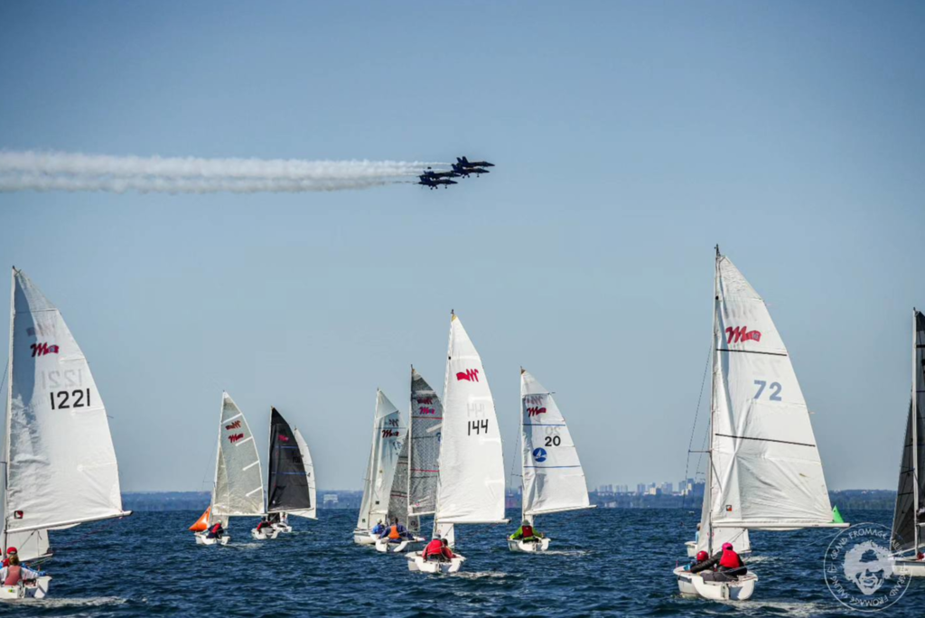 Jet plane formation over Martin 16 sailboats