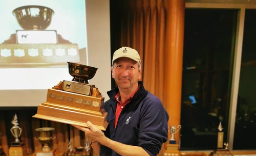 Sail racing award winner with trophy